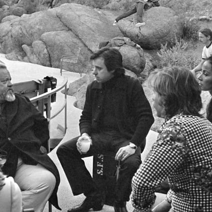 Orson Welles (second from left) on the set of The Other Side of the Wind. Photo: José María Castellví/Netflix