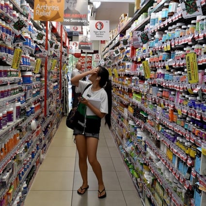 A customer browsing products at supplement outlet Mr Vitamins in Sydney. Photo: AFP