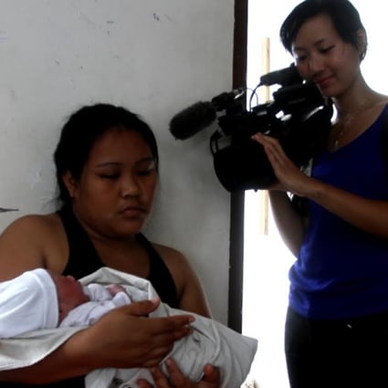 AFP video journalist Agnes Bun films the miraculous story of baby Bea Joy, who was born in the wake of Typhoon Haiyan five years ago.