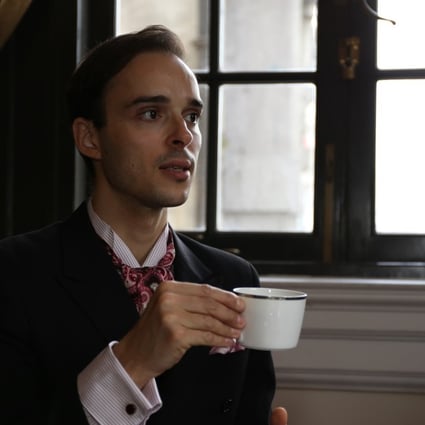 Guillaume Rué de Bernadac shows how to correctly hold a teacup at the Waldolf Astoria Shanghai.