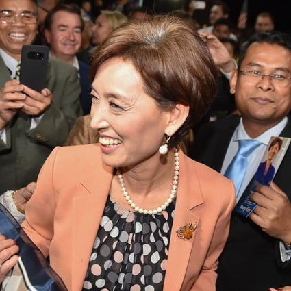 Young Kim is greeted by supporters as she arrives at an election night event. Photo: AFP