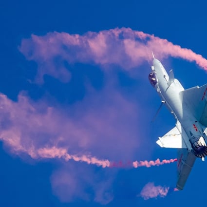 The PLA Air Force pilot shows visitors to Airshow China in Guangdong province what the latest engine developments can do in a J-10B TVC jet. Photo: Reuters