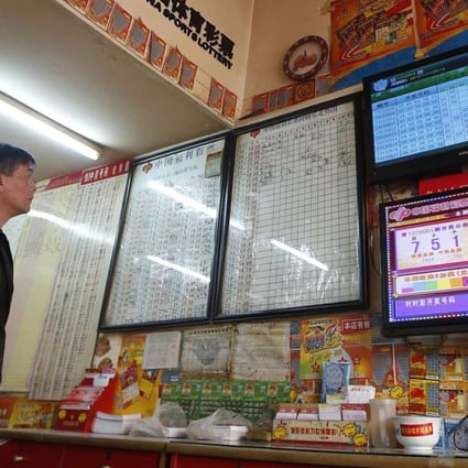 A customer at a Shanghai lottery story. The welfare and the sports lottery are the only legalised form of gambling on mainland China. Photo: Reuters