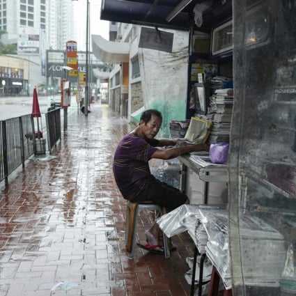 A news-stand in Kornhill stays open, as No 10 signal Typhoon Hato batters Hong Kong on August 23, 2017. The Basic Law says Hong Kong residents shall have freedom of speech, of the press and of publication. Photo: Robert Ng