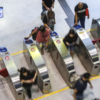 By the middle of 2020, commuters will have the option of entering MTR stations by linking their AlipayHK account to a separate MTR app, and scanning a QR code on their smartphones on the readers installed at the entry gates. Photo: Felix Wong