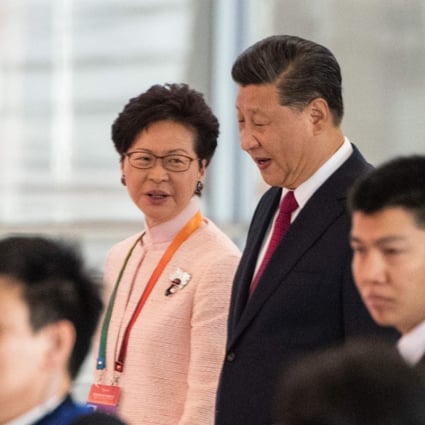 Hong Kong's Chief Executive Carrie Lam and China's President Xi Jinping arrive at the opening ceremony of the Hong Kong-Zhuhai-Macau Bridge at Zhuhai port on October 23. Photo: AFP