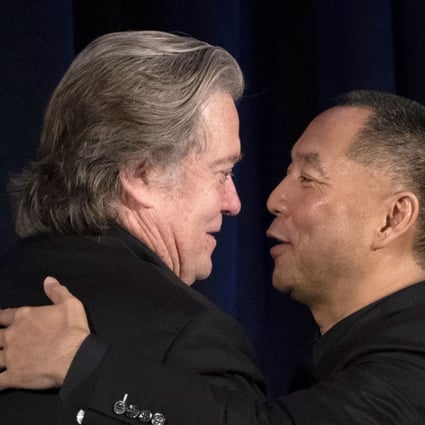 Former White House strategist Steve Bannon (left) greets fugitive Chinese billionaire Guo Wengui before introducing him at a news conference on Tuesday in New York. Photo: AFP