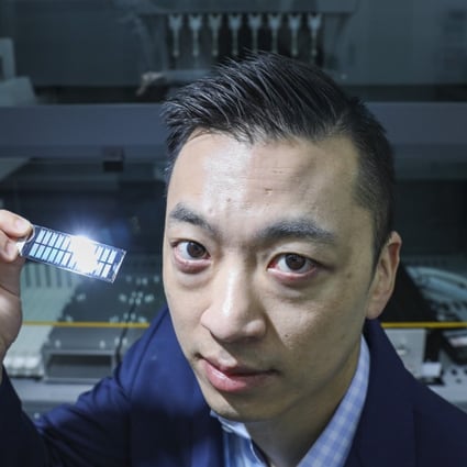 Danny Yeung Sheng-wu, CEO and co-founder of Prenetics, displays a biochip in the company’s laboratory for genetic testing in Quarry Bay, Hong Kong. Photo: Nora Tam