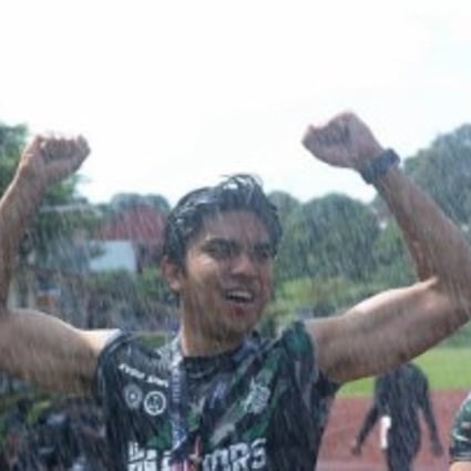 Syed Saddiq completes the Warriors Challenge obstacle course in pouring rain. Photos: social media