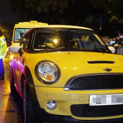 Wong Siew Fing, 47, and her daughter, Lily Khaw Li Ling, 17, were found dead in this yellow Mini Cooper. Photo: Edmond So.