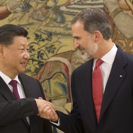 Chinese President Xi Jinping shakes hands with King Felipe of Spain in Madrid on Tuesday. Photo: AP