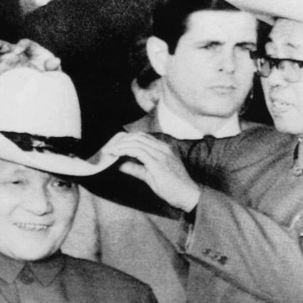 Deng tries on a cowboy hat in Texas, 1979. Photo: AP
