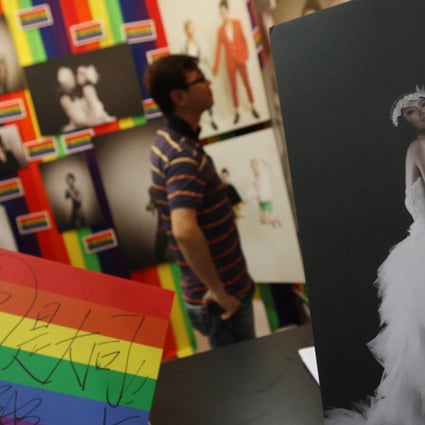 Hong Kong’s first-ever same sex marriage wedding service organiser BEvisible Production makes its debut at the Hong Kong Wedding Expo at the Convention and Exhibition Centre, Wan Chai, in June 2013. Since then, a slew of court cases have seen progressive judgments on same-sex unions, but legislation has not kept up. Photo: David Wong