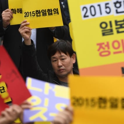 South Korean protesters hold up signs during a weekly anti-Japanese demonstration supporting “comfort women”, who served as sex slaves for Japanese soldiers during second world war, in front of the Japanese embassy in Seoul this month. The Japan Times said on Friday that it would no longer use the term ‘comfort women’. Photo: AFP