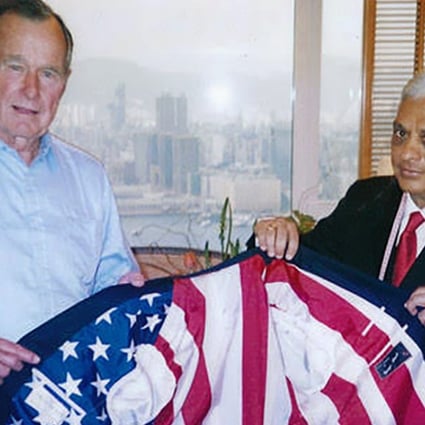 One of the most memorable pieces of tailoring Melwani (right) recalled making for Bush (left) was a bespoke suit jacket with an American flag. Photo: Handout