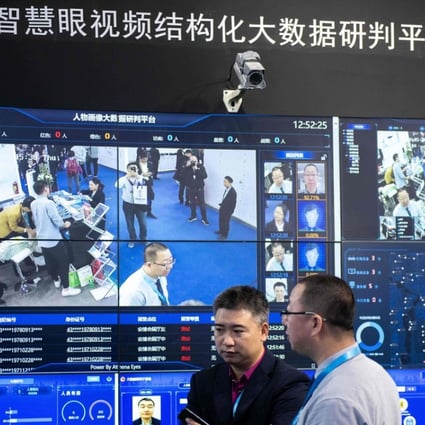 Visitors are filmed by AI security cameras using facial recognition technology at the 14th China International Exhibition on Public Safety and Security at the China International Exhibition Center in Beijing on October 24, 2018. Photo: AFP