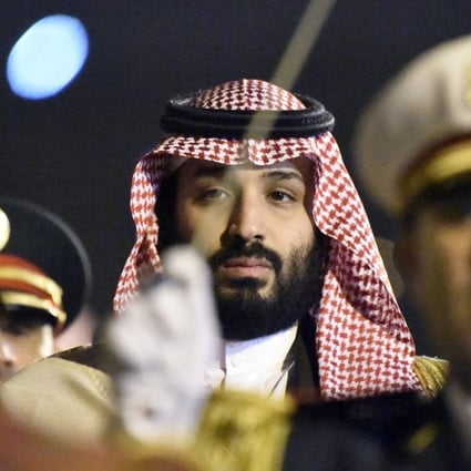 Saudi Crown Prince Mohammed bin Salman is seen behind a military band upon his arrival at Algiers International Airport, southeast of the capital Algiers on December 2, 2018. Photo: AFP