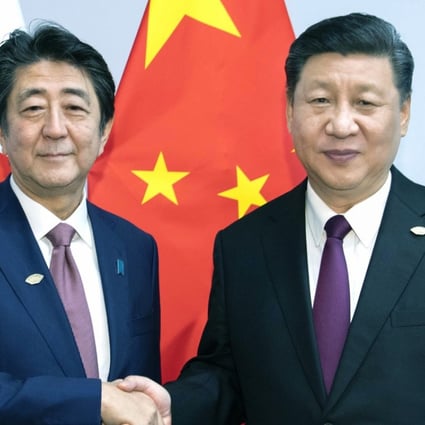 Japanese Prime Minister Shinzo Abe with Chinese President Xi Jinping. Photo: Xinhua