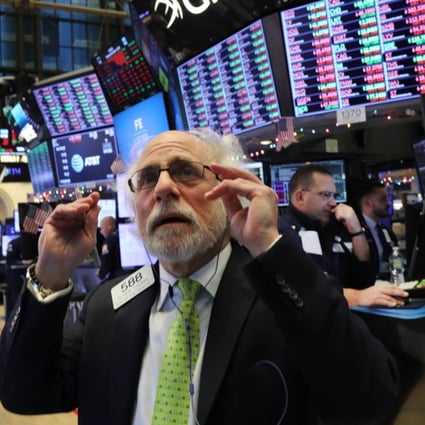 A trader works the floor of the New York Stock Exchange on Monday, when the Dow fell nearly 800 points. Photo: Getty Images/AFP