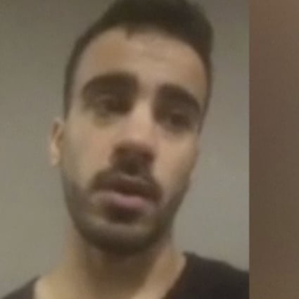 In this Thursday, November 29, 2018, image from video, Hakeem Al-Araibi speaks at Bangkok International Airport, Thailand. Australian officials raised with Thai authorities the plight of the Australia-based refugee professional soccer player who was detained in Bangkok and fears deportation to his native Bahrain, Australia's foreign minister said Friday, November 30, 2018. Rights groups are urging Thai authorities not to deport Al-Araibi to his homeland, where he faces imprisonment for what his supporters say are political reasons. Al-Araibi was detained at the airport on Tuesday. (SBS via AP)