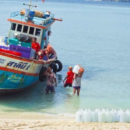 A boat delivers drinking water to Phi Phi Don Island, in Thailand, in 2016.