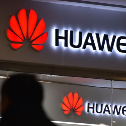A man walks past a Huawei store in Beijing on December 10, 2018. Photo: AFP