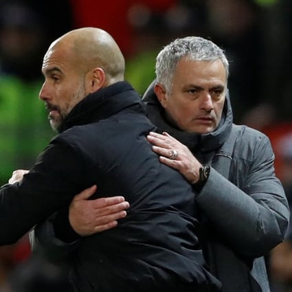 Pep Guardiola and Jose Mourinho embrace after the Manchester derby in December 2017. Photo: Reuters