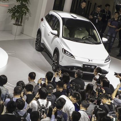 He Xiaopeng, chairman and co-founder of Xpeng Motors Technology Ltd., speaks as he stands next to the company's G3 electric sport utility vehicle (SUV) at the Guangzhou International Automobile Exhibition in Guangzhou, China, on Friday, Nov. 16, 2018. Photo: Bloomberg