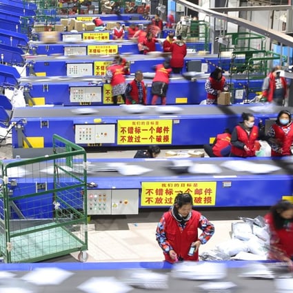 Staff members work at the distribution centre of the Hengyang branch of China Post in Hengyang City, central China's Hunan Province, November 12, 2018. Photo: Xinhua