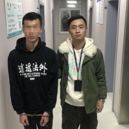 The teenager pictured in custody with the offending top. Photo: Handout