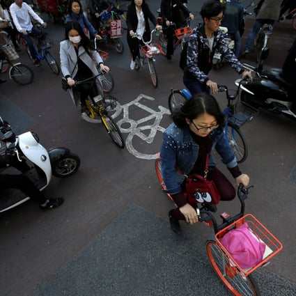 Bikes join the morning rush hour in Beijing’s central business district in April 2017. But Hong Kong is no Beijing or Shanghai. Photo: Reuters
