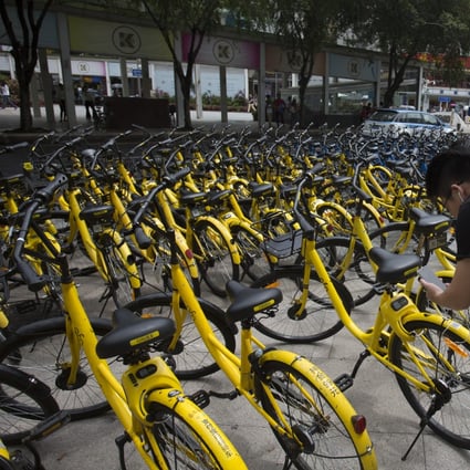 People using mobile payments to rent Ofo bikes in Shenzhen, China. Photo: SCMP