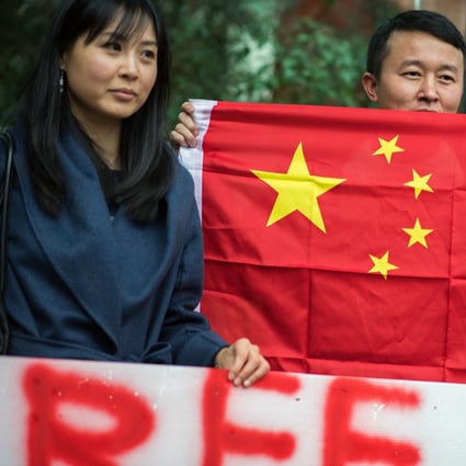 A man holds a Chinese flag in support of Huawei executive Meng Wanzhou outside a bail hearing in Vancouver on December 11. China has reacted to the incident by hitting back at Canada, instead of winning more friends around the world. Photo: Bloomberg