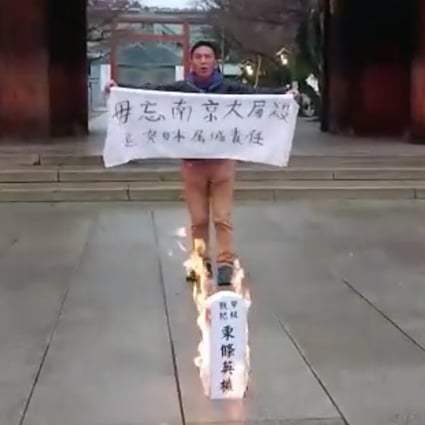 Alex Kwok at the shrine setting fire to a symbolic ancestral tablet condemning country’s war criminal. Photo: Facebook