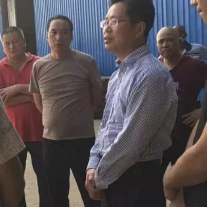 Chinese embassy officials pictured at the factory. They have urged police to step up their investigations. Photo: weixin.qq.com