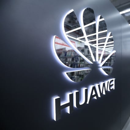 A Huawei Technologies Co. logo sits on display as customers browse inside a Media Markt electronic goods store, operated by Ceconomy AG, in Berlin, Germany, on Monday, Dec. 17, 2018. Photo: Bloomberg