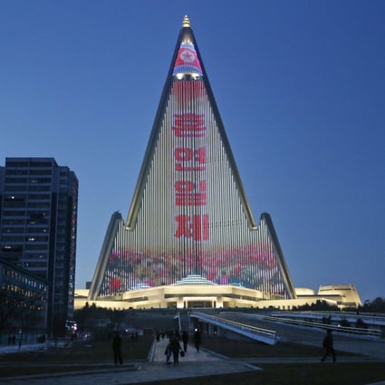 A propaganda message is displayed on the facade of the pyramid-shaped Ryugyong Hotel in Pyongyang. Photo: AP