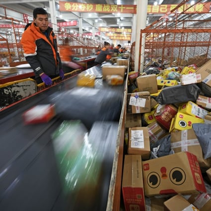 Staff members work at a distribution centre of an express delivery company in northwest China's Ningxia Hui autonomous region. China’s new e-commerce law comes amid the country’s rapid development into the world’s largest e-commerce market, with estimated sales of US$1.53 trillion in 2018. Photo: Xinhua