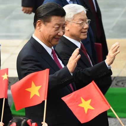 Chinese President Xi Jinping (C) and Vietnam's Communist Party Secretary General Nguyen Phu Trong (R). Photo: AFP