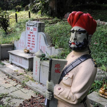 Statues of Sikh guards at Bukit Brown, one of Singapore’s oldest cemeteries. Photo: AFP