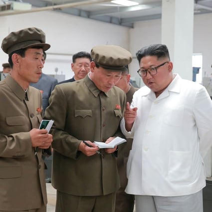 North Korean leader Kim Jong-un gives field guidance during his visit to a machine factory under the Ranam coal mining complex. Photo: Reuters