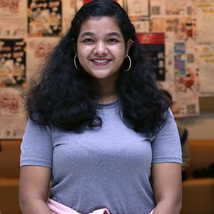 Fariha Salma Deiya Bakar, 20, balances her studies at City University and work as a part-time Legco assistant. Photo: Jonathan Wong