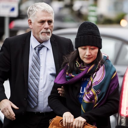 Huawei chief financial officer Sabrina Meng Wanzhou arrives at a parole office with a security guard in Vancouver, British Columbia, part of her bail arrangement with the Canadian authorities. Photo: AP