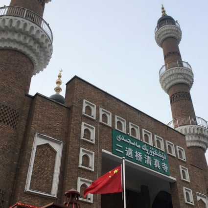 The Chinese national flag flies outside the mosque at the Xinjiang International Grand Bazaar in the regional capital Urumqi. Photo: Reuters