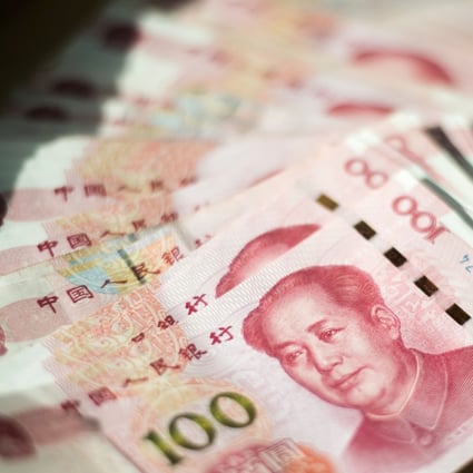 The People’s Bank of China will reduce the required reserve ratio by one percentage point this month so that banks have sufficient funds to lend. Photo: AFP