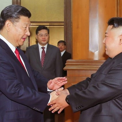 Chinese President Xi Jinping shakes hands with North Korean leader Kim Jong-un in Beijing in this undated photo released June 20, 2018. Photo: KCNA via Reuters