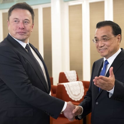 Elon Musk told Chinese Premier Li Keqiang he wished he could visit China more often. Photo: EPA-EFE