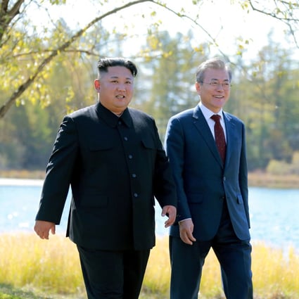 South Korean President Moon Jae-in and North Korean leader Kim Jong-un walk during a luncheon, in this photo released by North Korea's Korean Central News Agency (KCNA) on September 21, 2018. Photo: Reuters