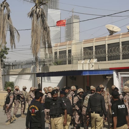 Pakistani security personnel in the compound of the Chinese consulate in Karachi on November 23. Five suspects have been arrested over the attack. Photo: AP