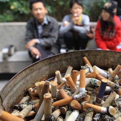 Smokers out in the open outside the Immigration Tower in Wanchai on 20 January 2011. Photo: SCMP